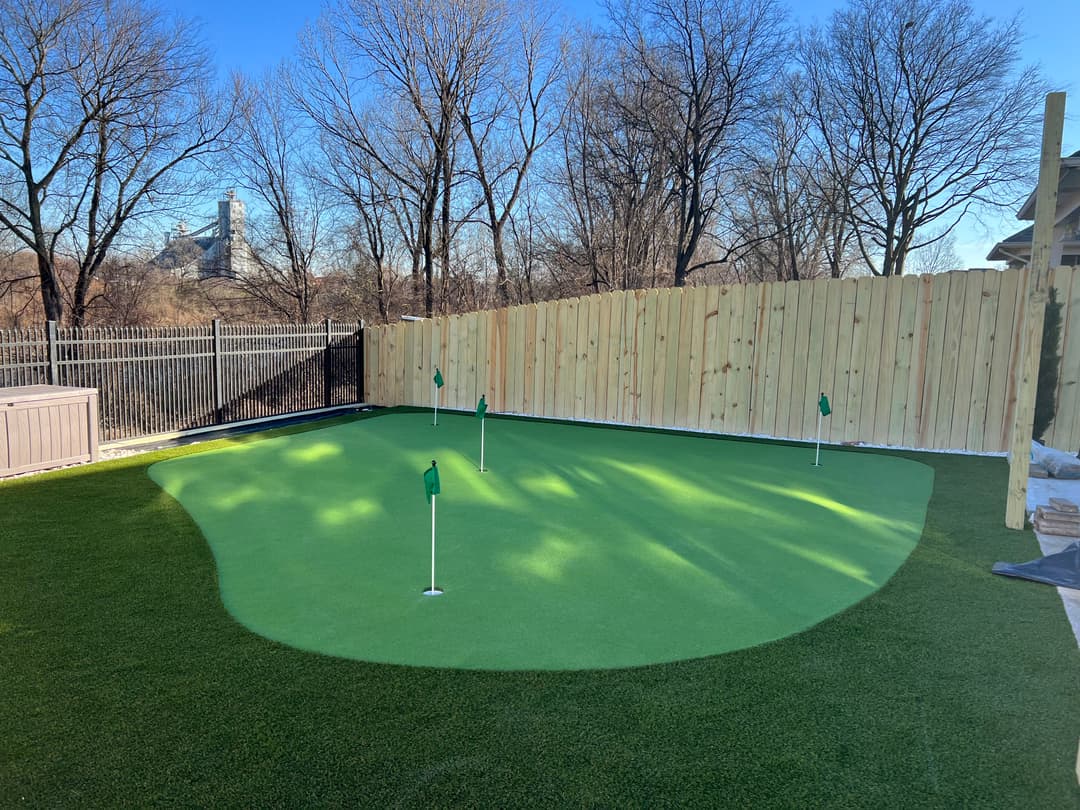 Backyard artificial turf putting green installation in Memphis, TN designed for clean drainage, smooth play, and a low-maintenance lawn solution ideal for pets, kids, and year-round use.